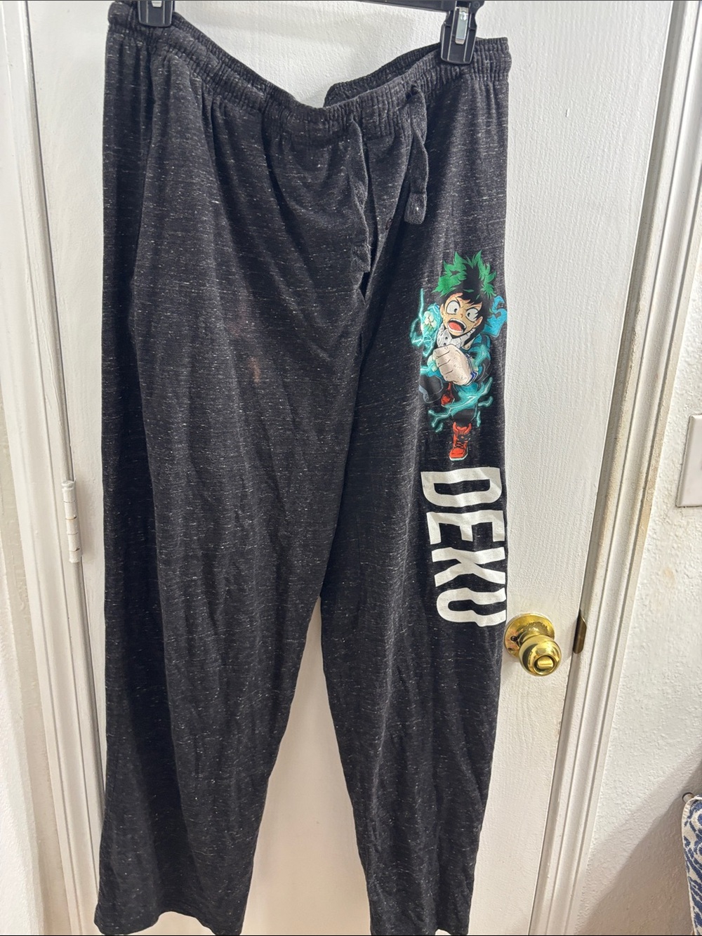 Black 'Deku' Graphic Lounge Pants for Men there is a light Clorox stain